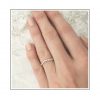 Curved White Gold Wedding Band Styled on Hand