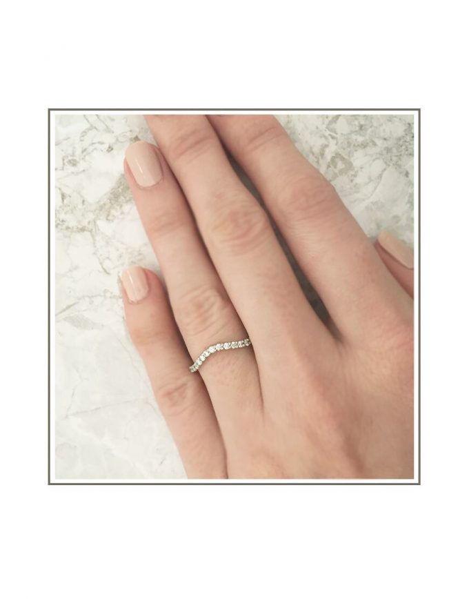 Curved White Gold Wedding Band Styled on Hand